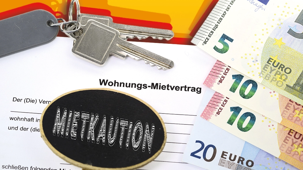 Mietkaution und Wohnungs-Mietvertrag mit Euro-Geldscheinen und Schlüsseln zur Wohnungsübergabe.