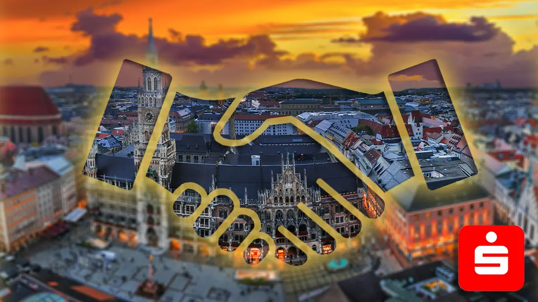 Handschlag-Symbol vor dem Münchner Rathaus am Marienplatz bei Sonnenuntergang für lokale Partnerschaft.